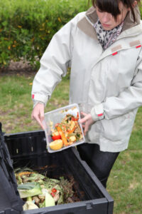 adding food waste to compost