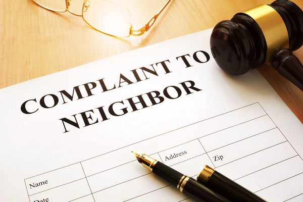 complaint to neighbor form on a table 