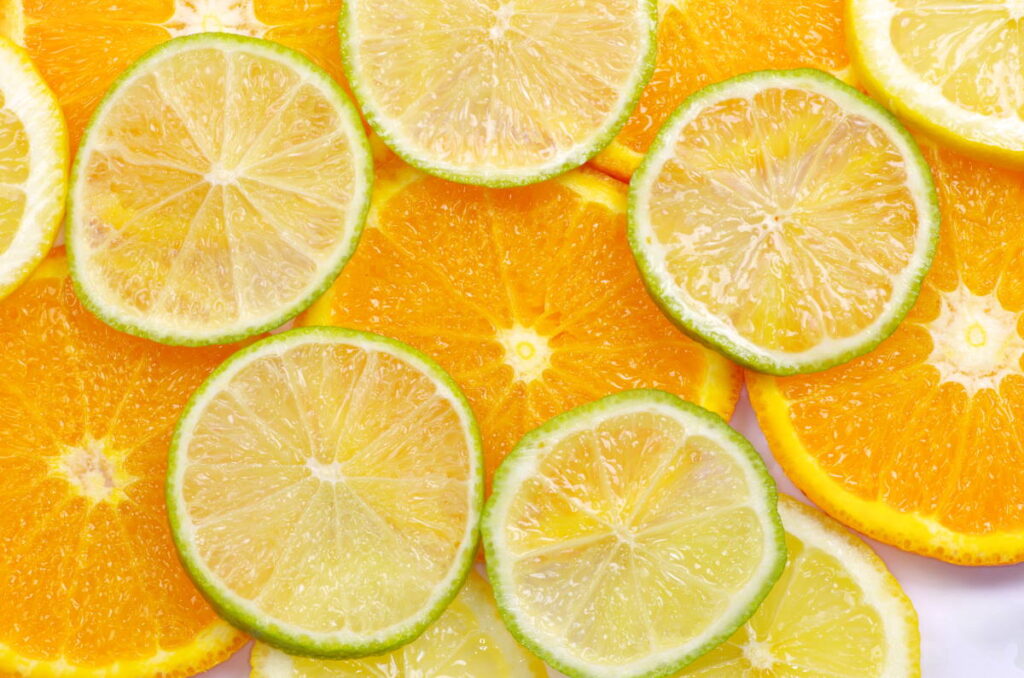 Mixed sliced citrus fruit background can you compost citrus fruit?