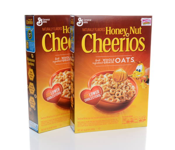 Two boxes of Honey Nut Cheerios. Don't put colored cardboard in compost, like cereal boxes