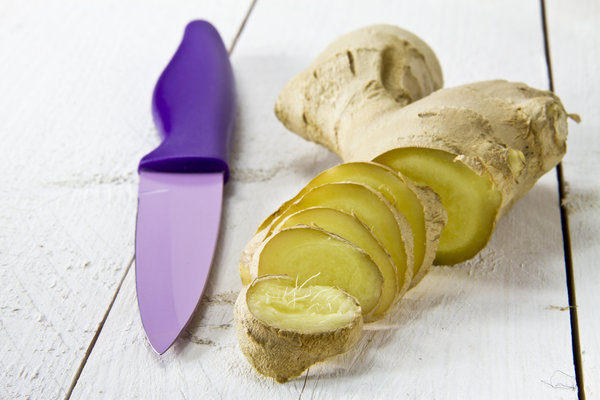 cut up ginger next to a knife