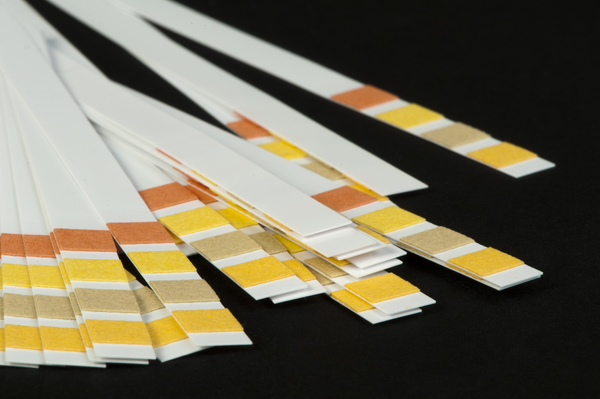 litmus strips for measuring acidity - the color tells you the pH of the substance